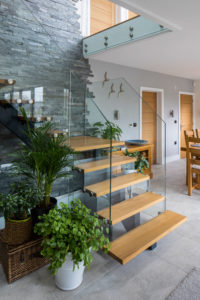 Floating timber staircase with glass balustrades