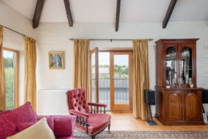 Traditional sitting room with exposed beams