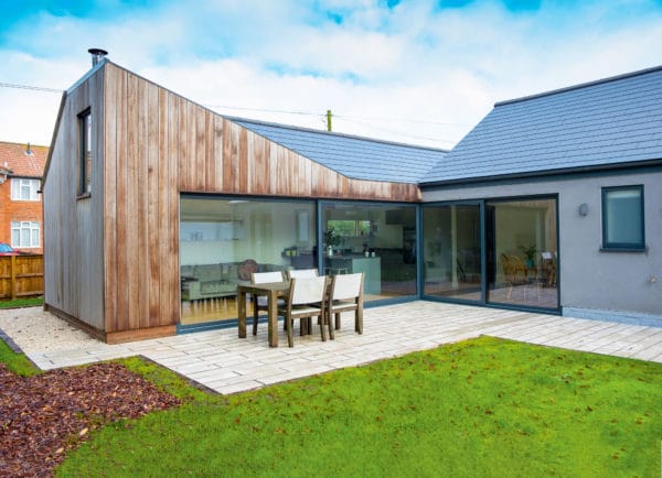 Timber clad extension surrounds garden