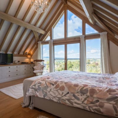 Exposed oak beams in bedroom