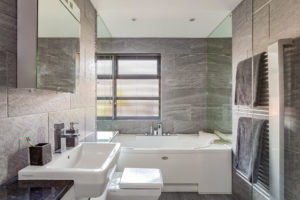 Grey-tiled bathroom