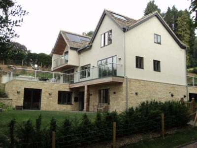 three storey deatcehd house with white render