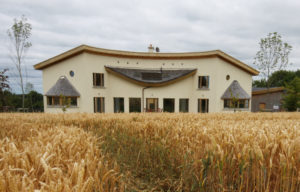 Curved house in corn field