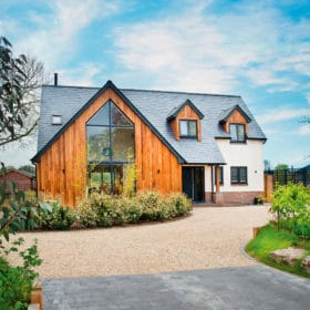 Timber clad house with geometric shapes