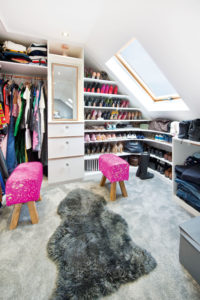 Dressing room with in-built shelves and skylight
