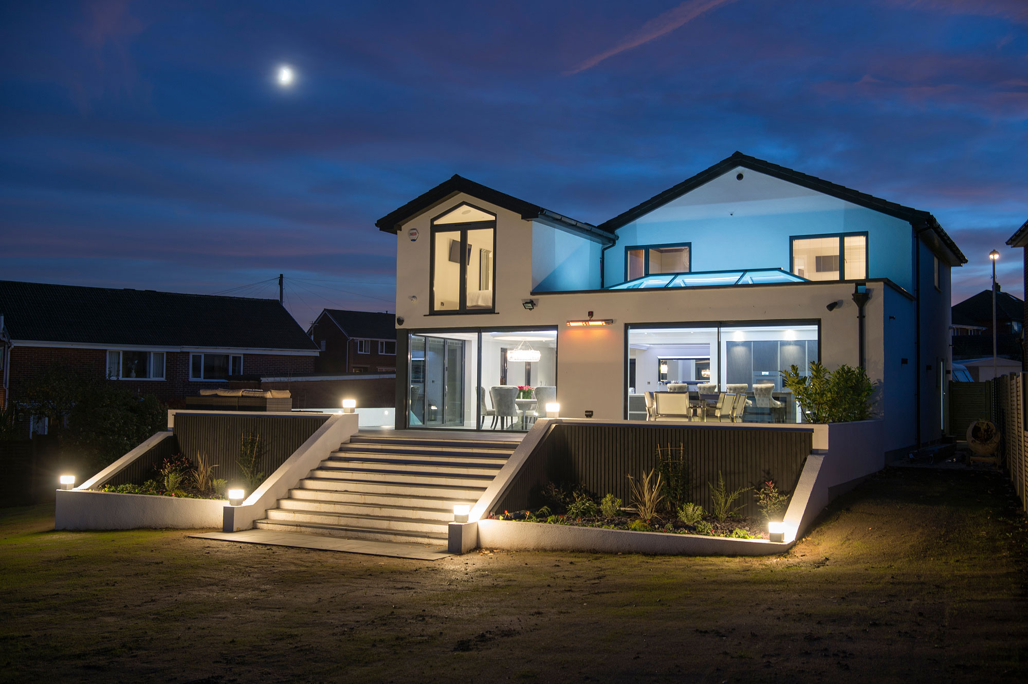 Contemporary house with extension at dusk