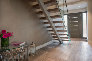 Hallway with floating tread stairs