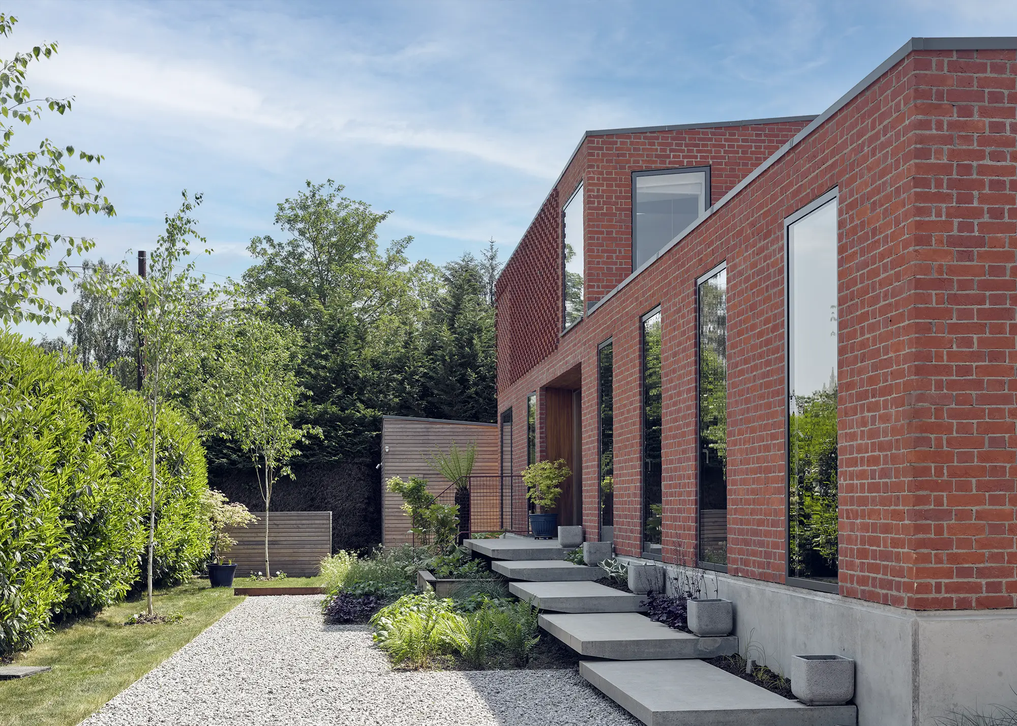 Waterfront Mid-Century Style Self Build with Unique Brick Details