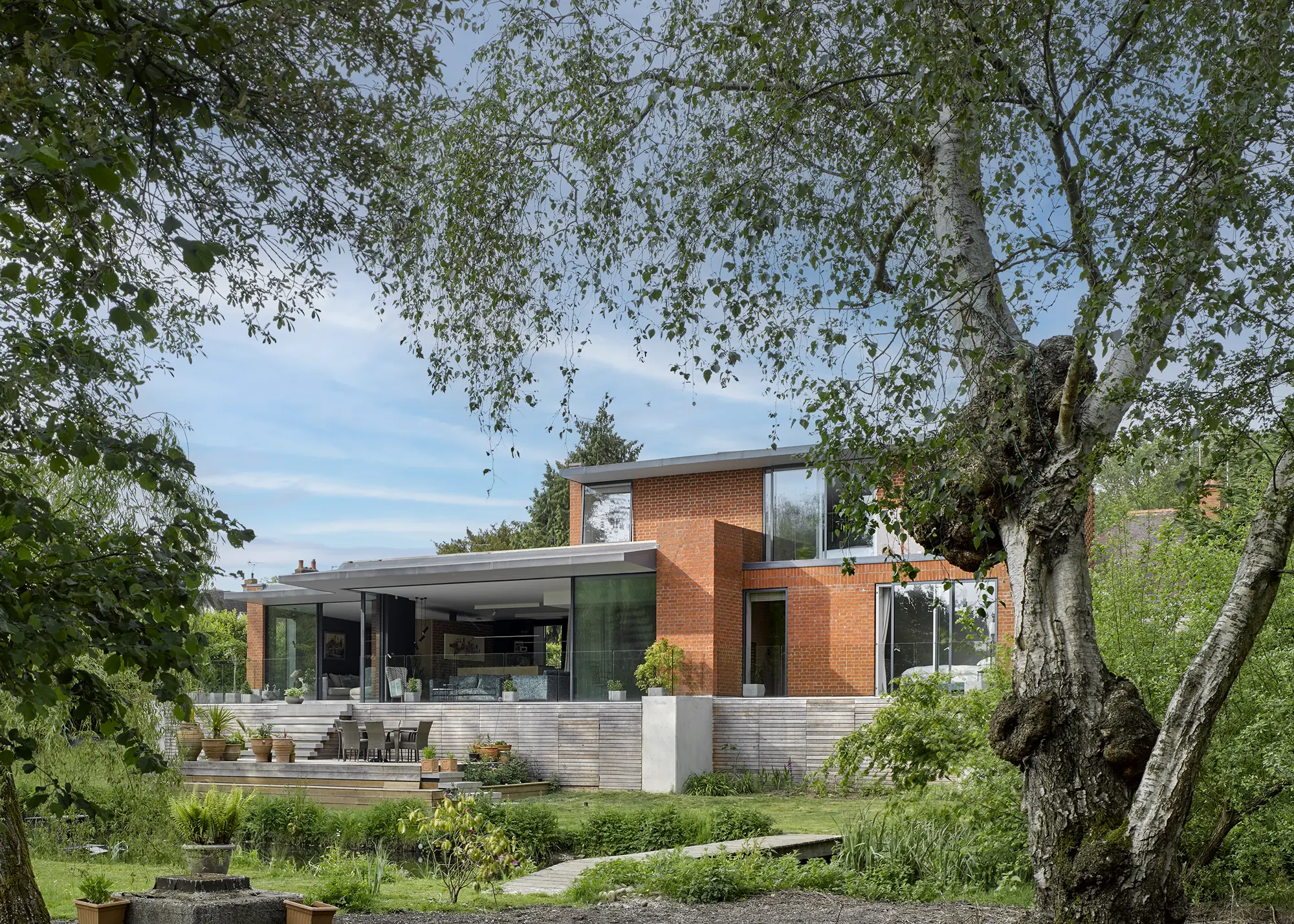Waterfront Mid-Century Style Self Build with Unique Brick Details
