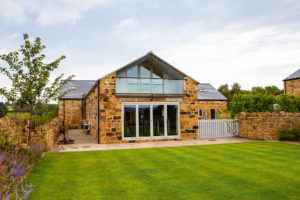 Brick house with glazed wall