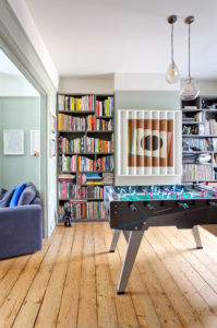 Games room with timber floorboards
