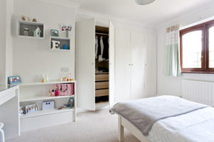 White bedroom with bed thro