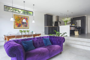 Sitting room with purple sofa