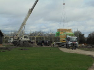 House being craned into position
