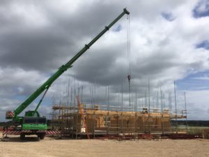 Crane lifting new house