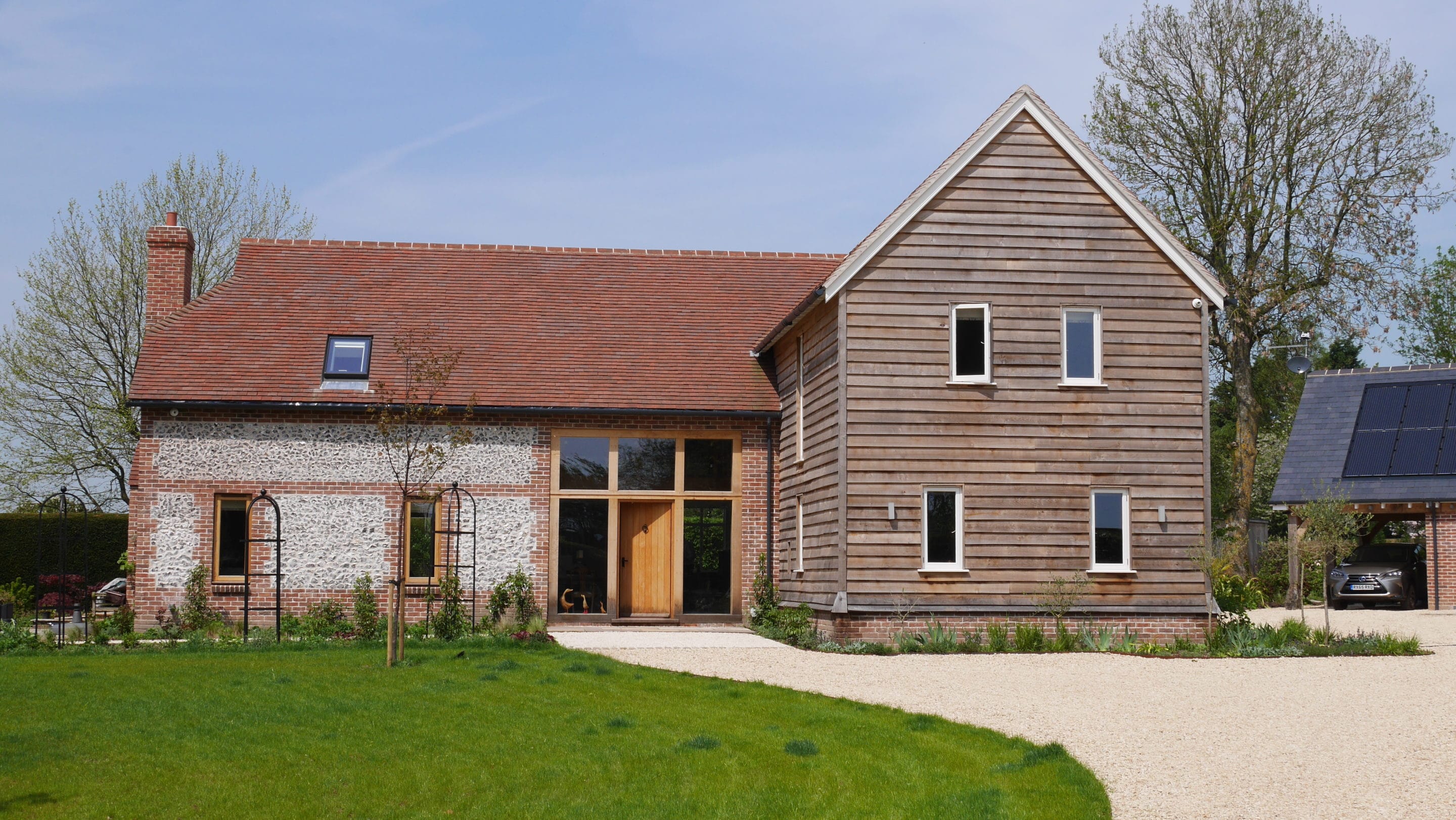 Timber frame house with drive
