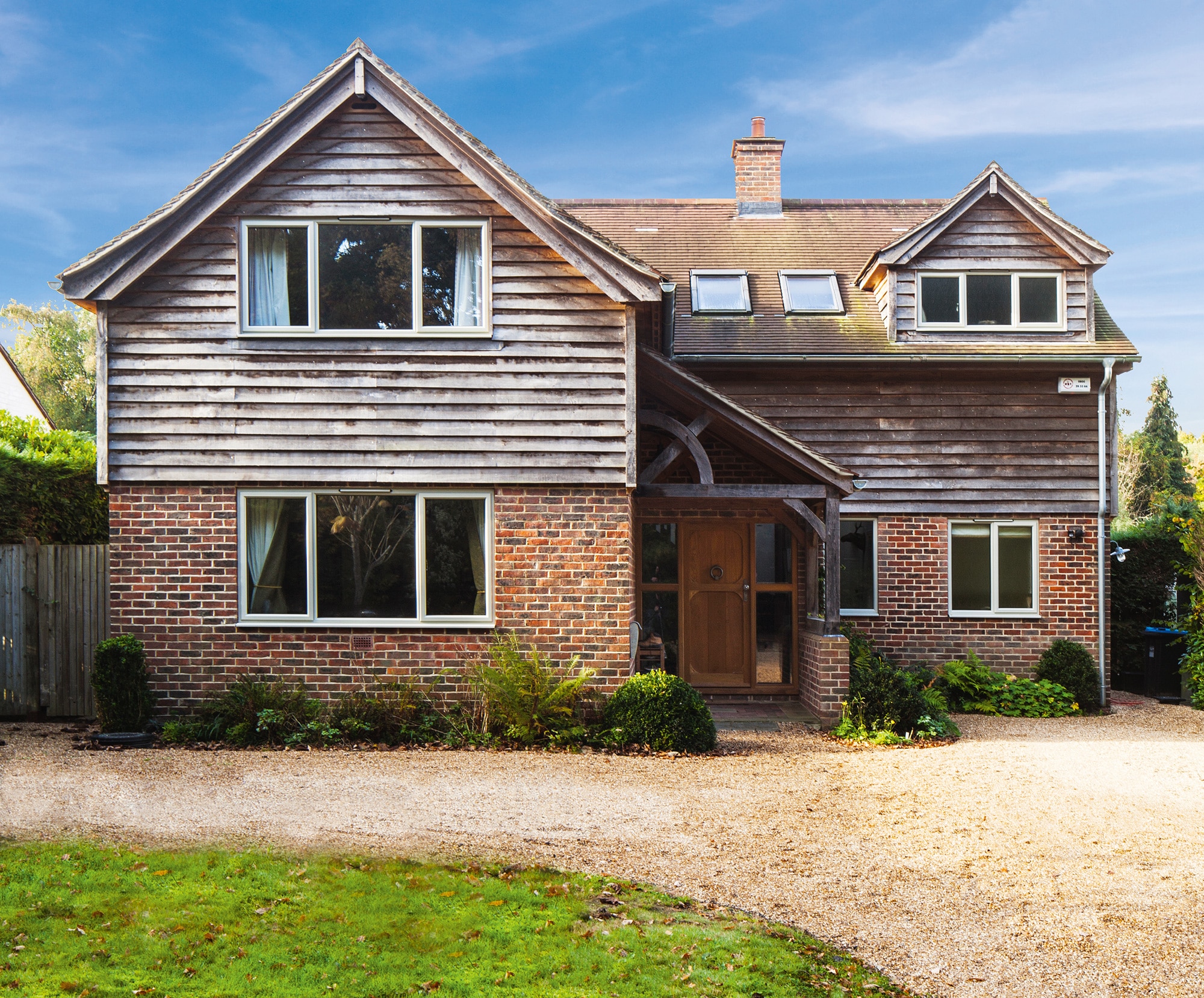 Timber clad and brick house