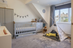 Nursery with grey carpet