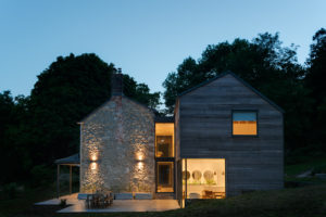 Cottage with extension at dusk