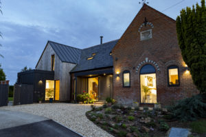 Timber clad house with brick