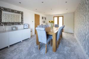 Dining room with grey carpet