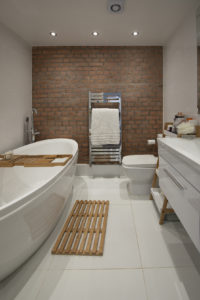 Bathroom with brick feature wall