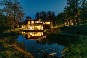 House at dusk on lake