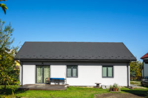 White render house with metal roofing