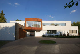 Timber clad and white render house