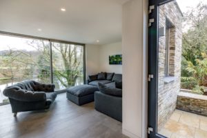 Living room with black sofas