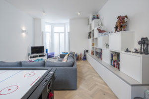 White room with wooden parquet flooring