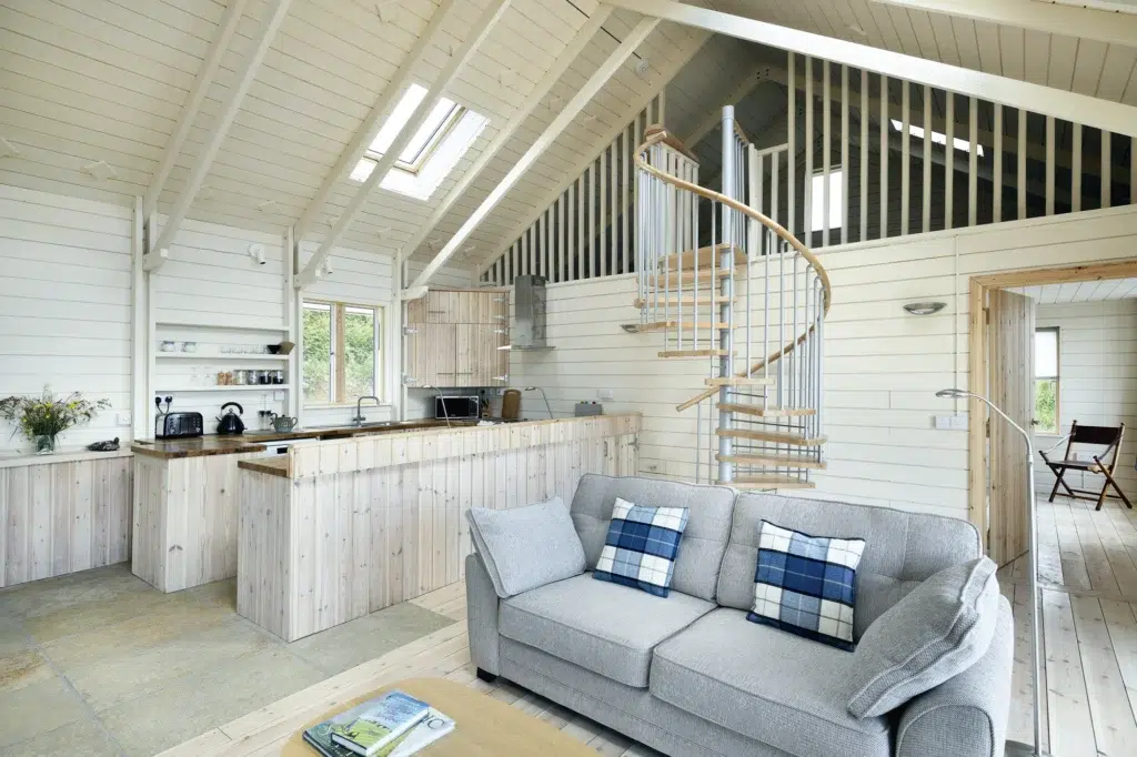 Living area with mezzanine and spiral staircase