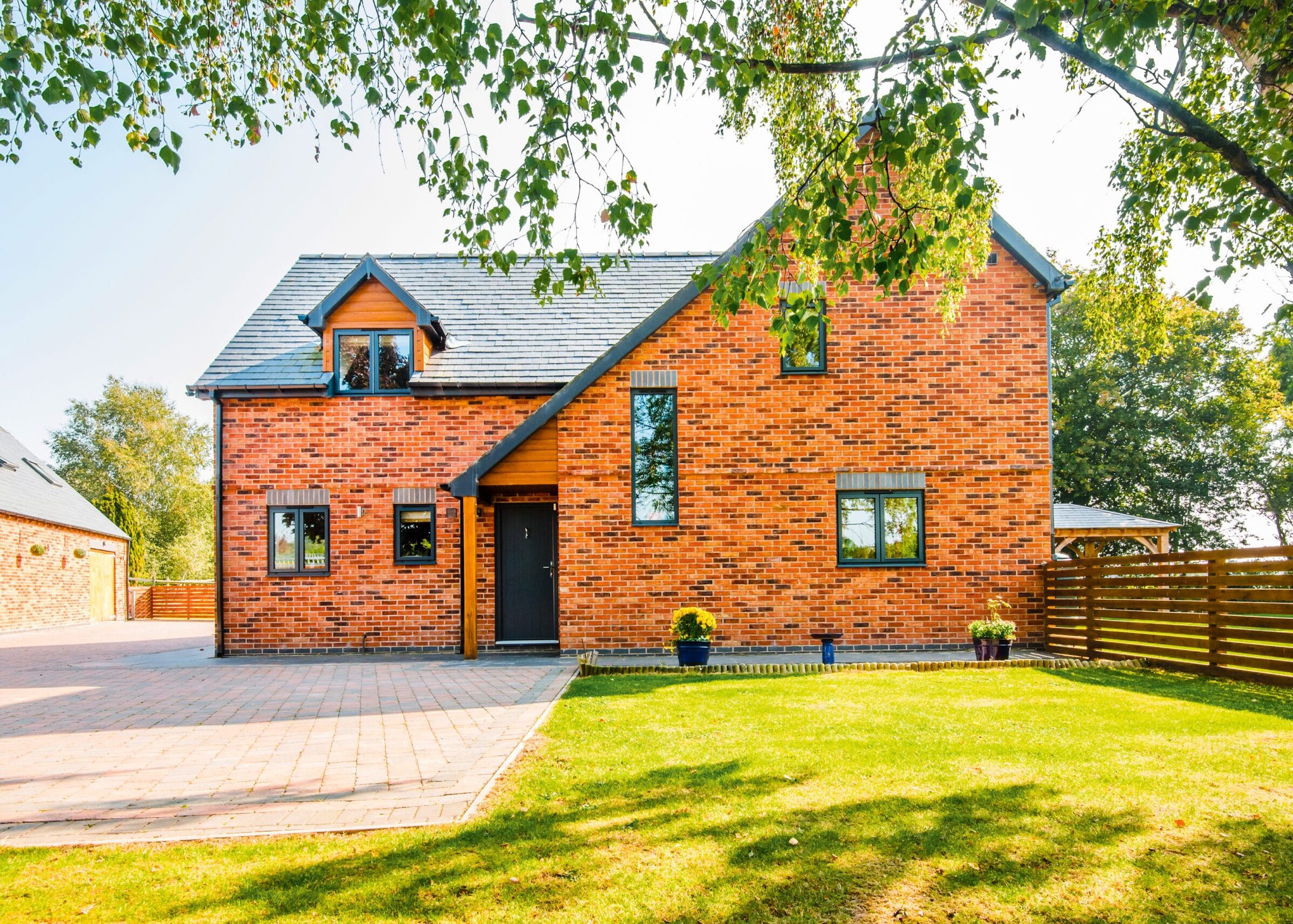 Detached brick house with garden