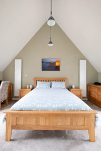 Bedroom with vaulted ceiling