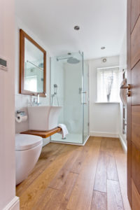 Shower room with timber floor