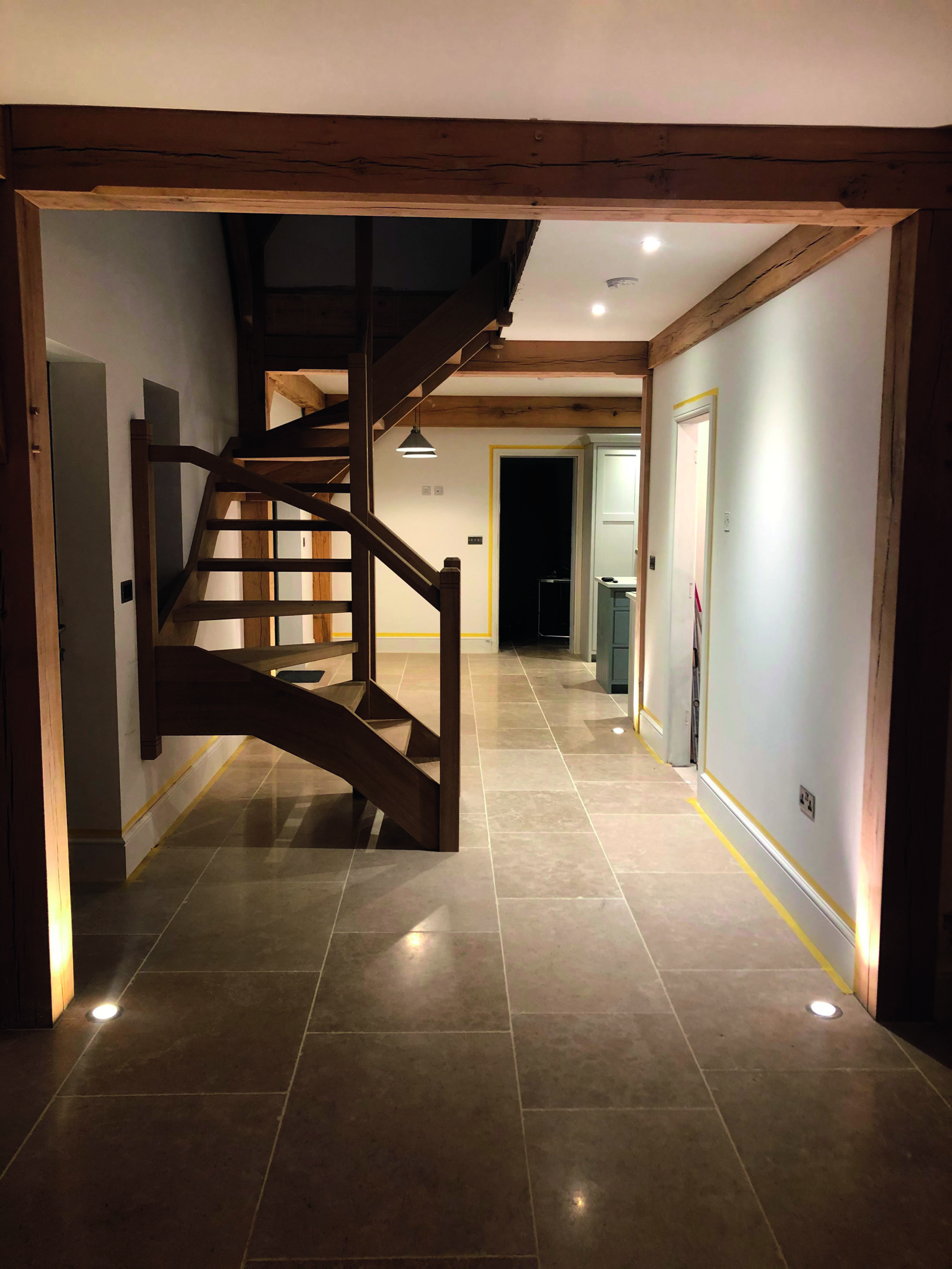 Hallway with flagstones and stairs