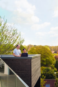 Couple standing on roof