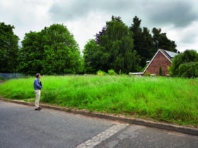 Mike Dade surveying plot