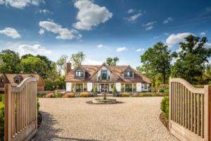 White render hosue with driveway