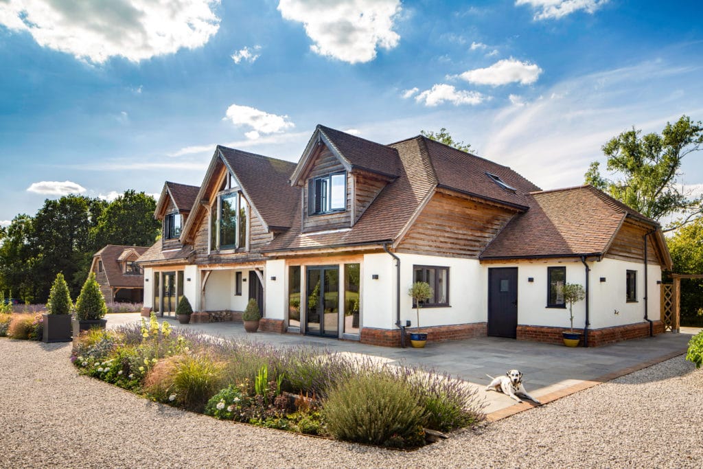 White render house with cladding