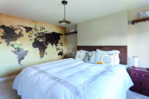 Bedroom with map on wall