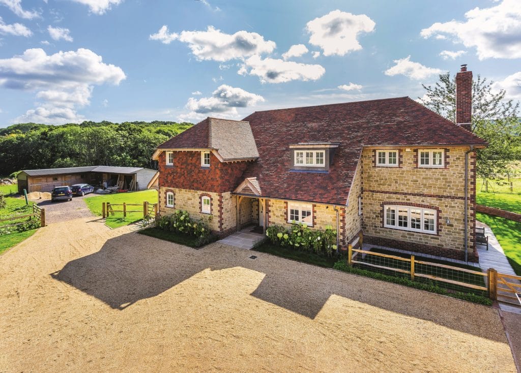 Modern timber frame home with traditional brick facade
