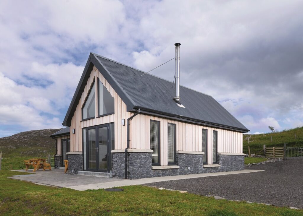 Compact self build home with timber cladding exterior