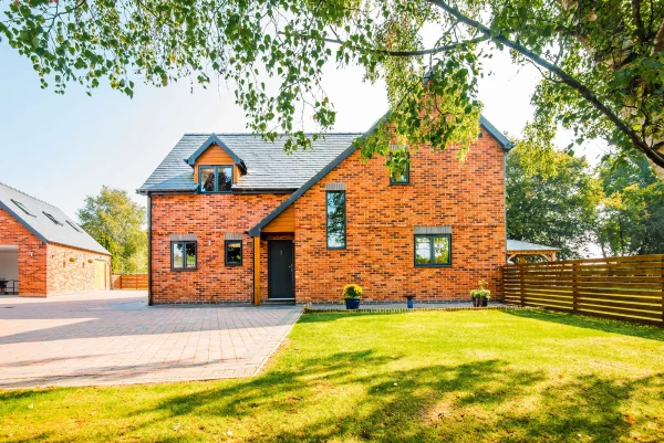 Detached brick house with garden