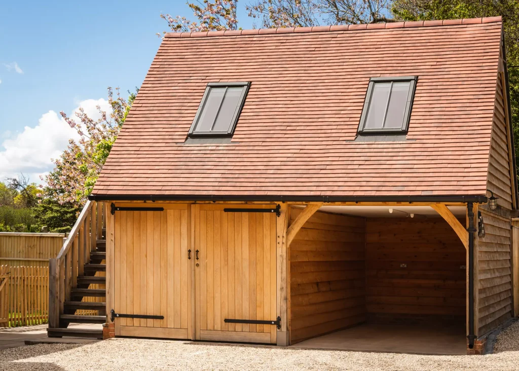 oak frame garage with oak doors, rooflights and side stairs