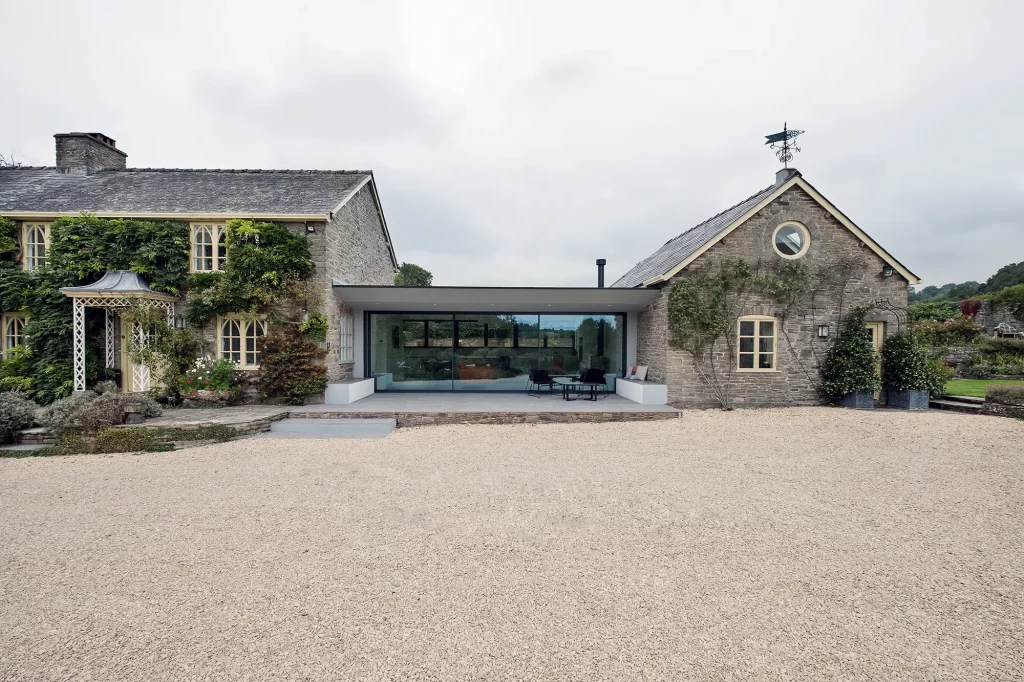 One storey glazed extension connecting a cottage and its annexe