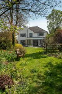 Garden with remodelled home in the distance