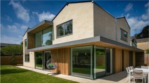 Family home in Bath stone with Brimstone cladding