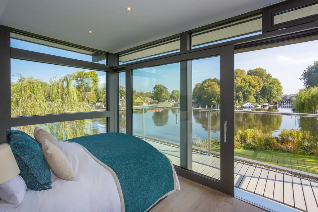 Bedroom with a view of the water by Huf Haus