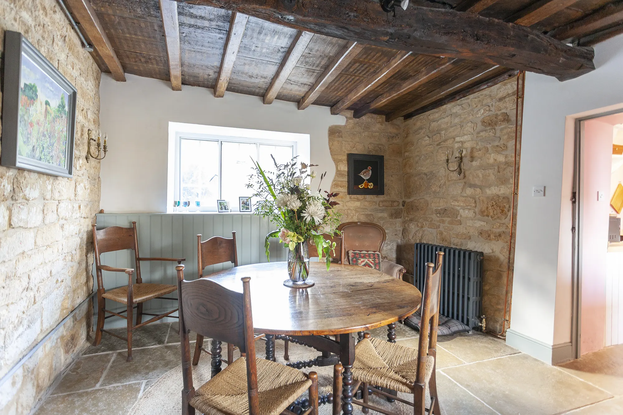 Dining area with oak beam ceiling